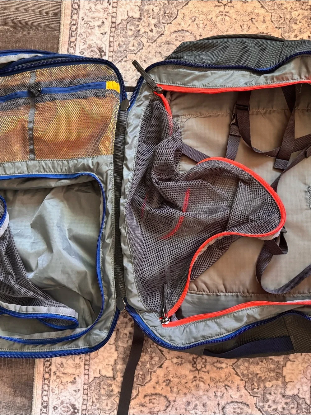 cotopaxi Light Blue Backpack with Red, Orange, Teal & Purple Accents